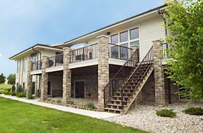 This Zach Builders custom home features a beautiful two-story deck